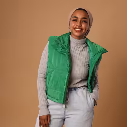 Green puffer vest women's fashion by Estringo Egyptian outerwear collection